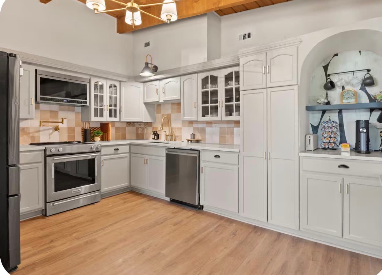 Bright kitchen with warm wood ceilings at the Dallas Creative Connect location.
