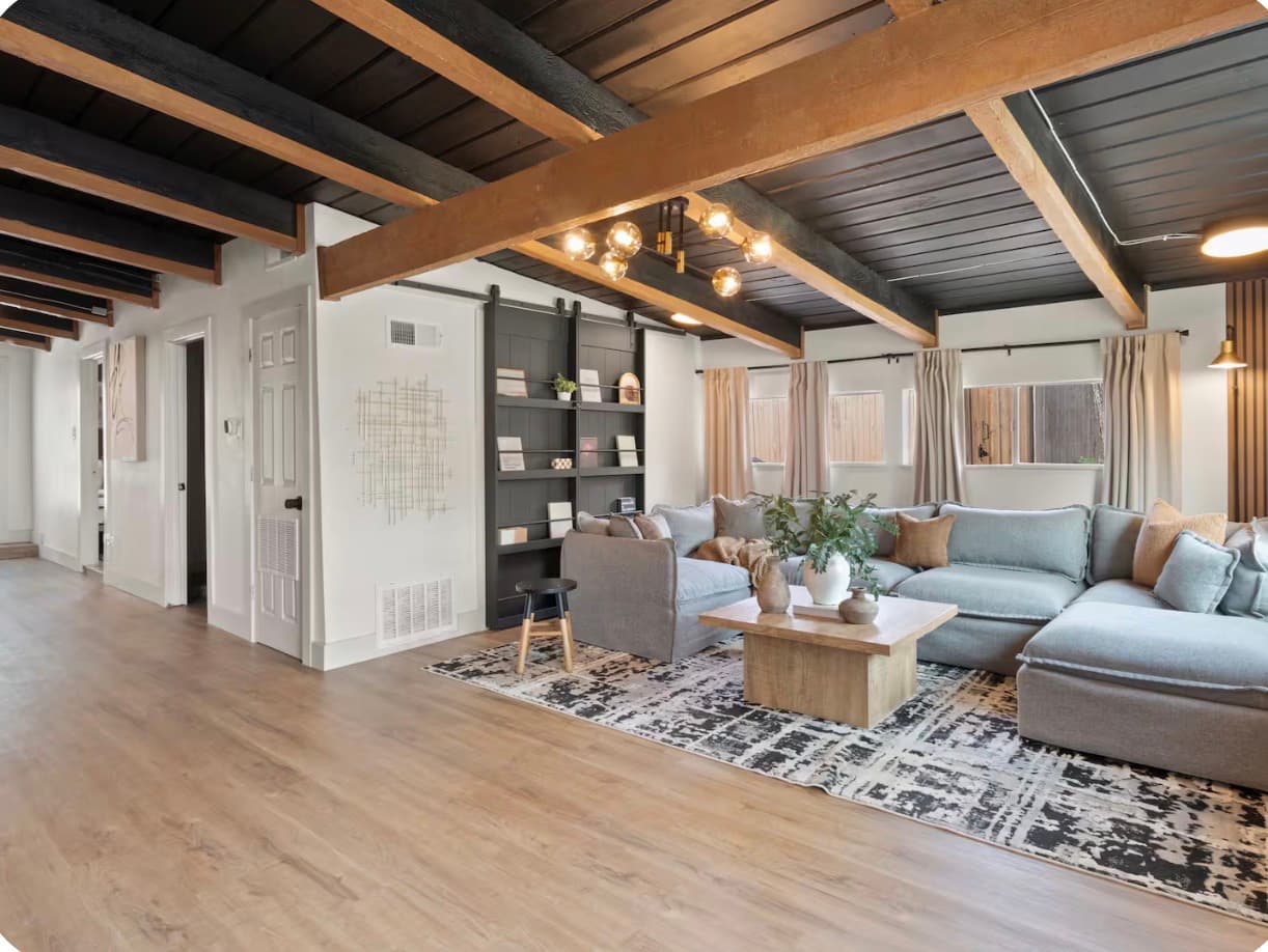Living room connected to a long open hallway at the Dallas Creative Connect location.