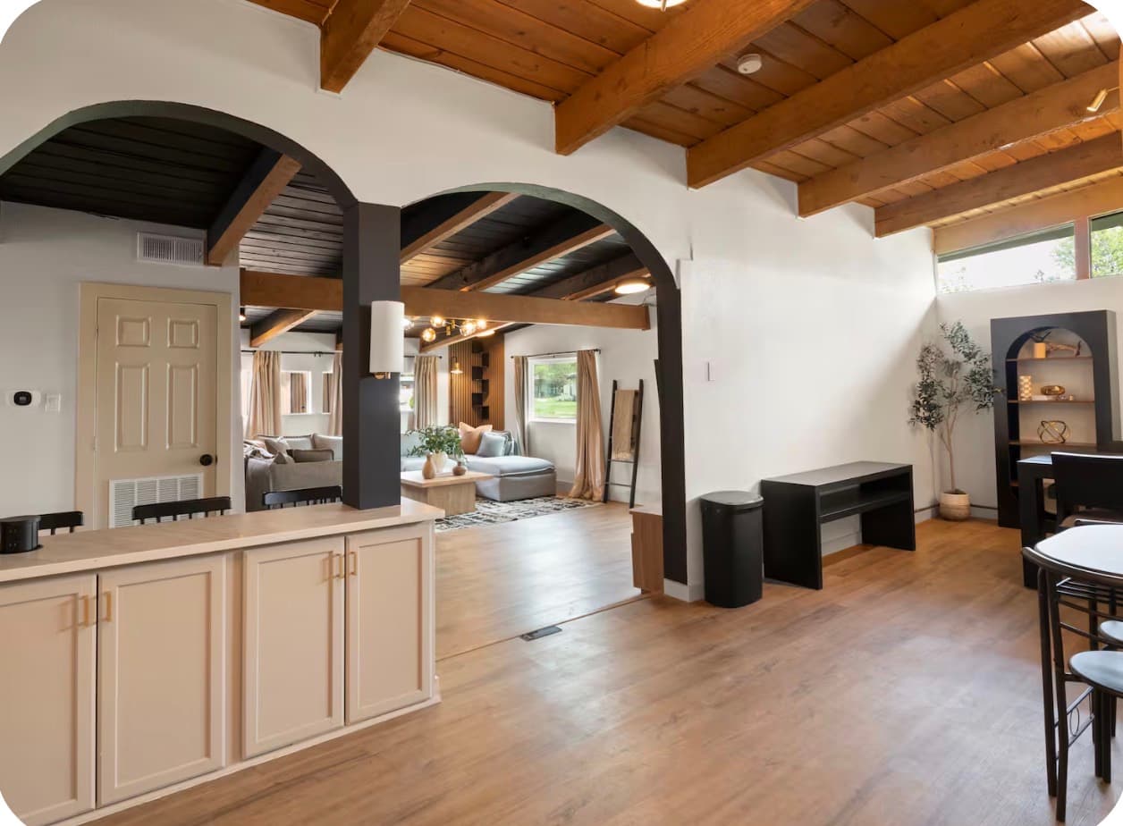 Open living, dining, and kitchen areas inside the Dallas Creative Connect location.